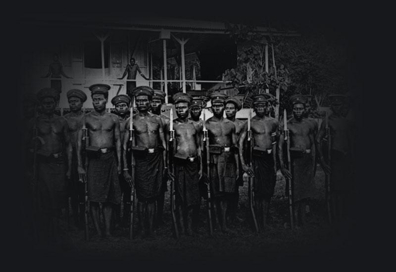 Native Police with rifles, from a collection of glass plate negatives probably taken about 1909 by the surveyor Sabine.