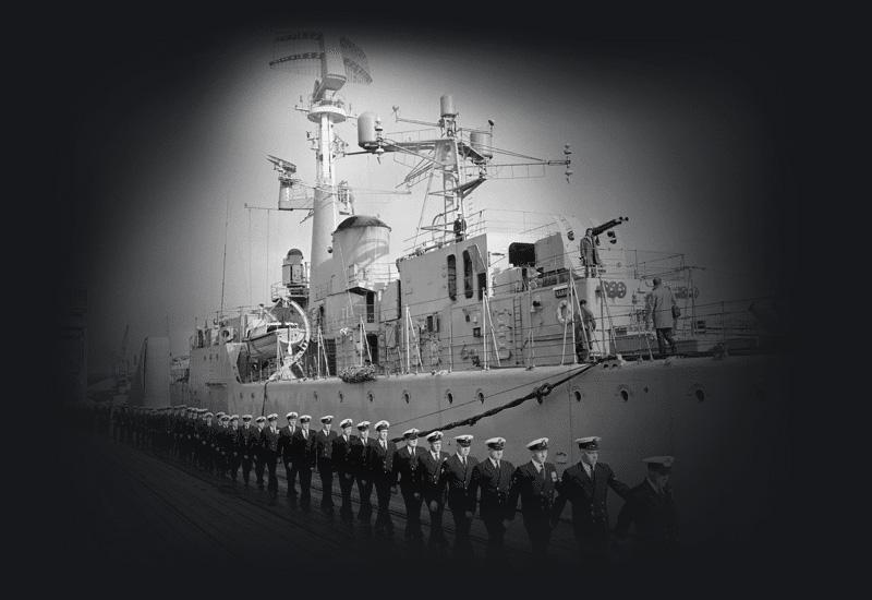 Royal Australian Navy personnel march aboard the newly commissioned HMAS Yarra, 1961.