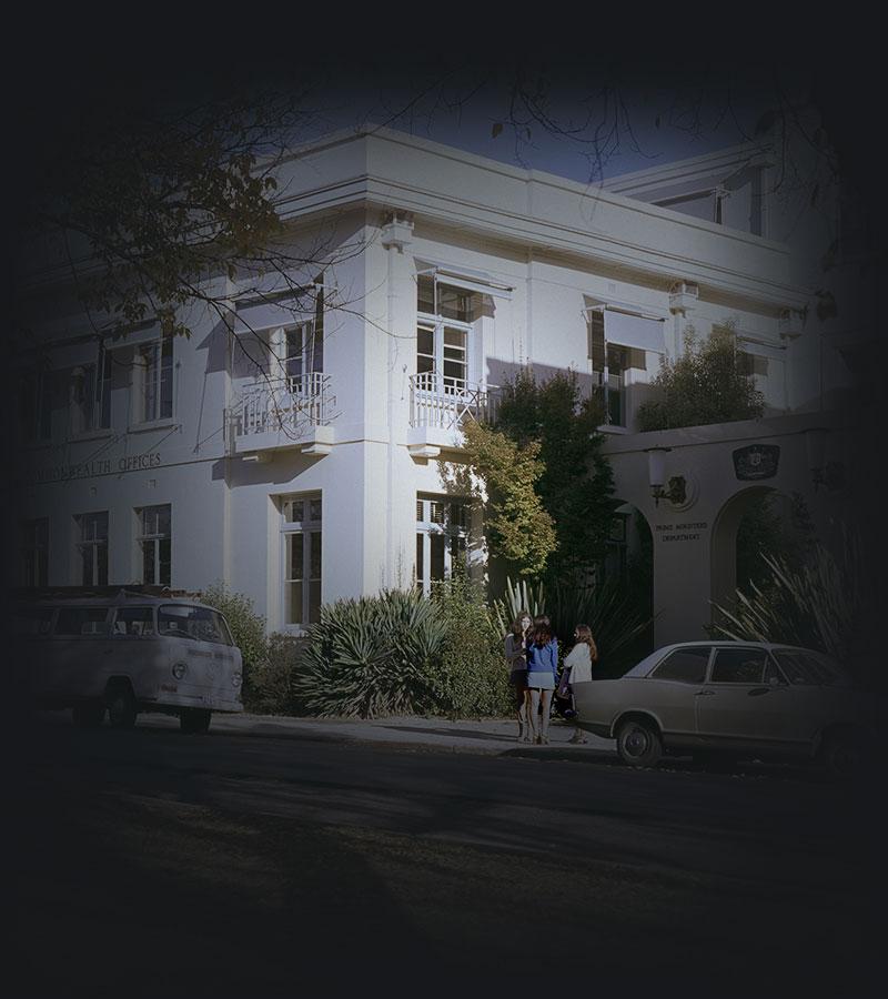 Cars parked beside East Block Commonwealth Offices.