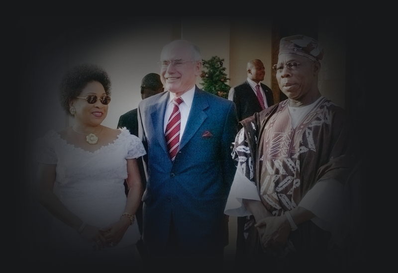 John Howard standing with the President of Nigeria, Olusegun Obasanjo, and his wife Stella Obasanjo.