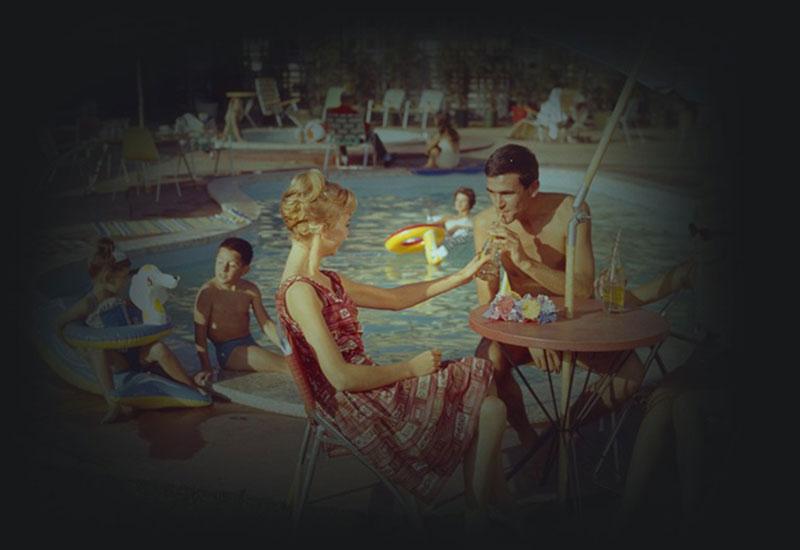 Guests dining by the motel pool.
