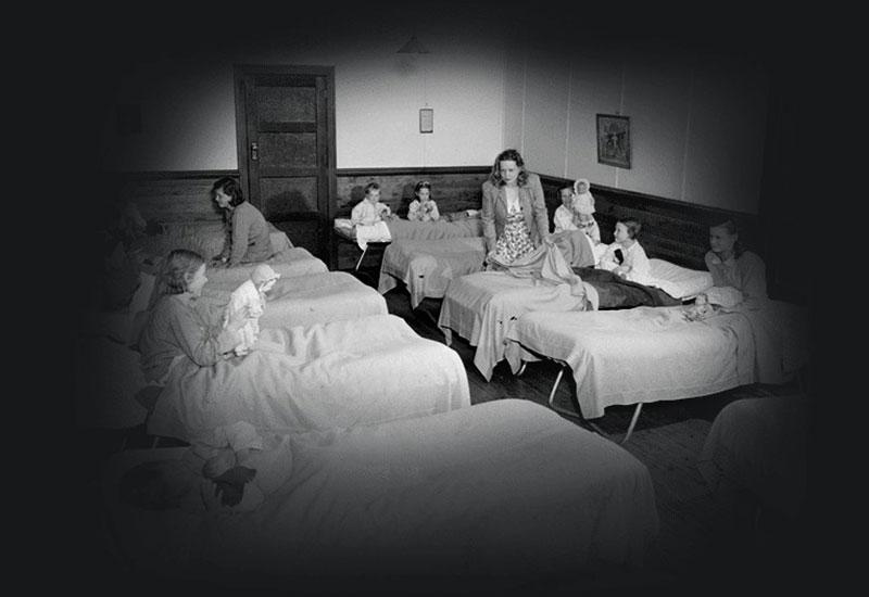 Child migrants chatting in bed at Fairbridge Farm School, Molong, NSW, 1954.
