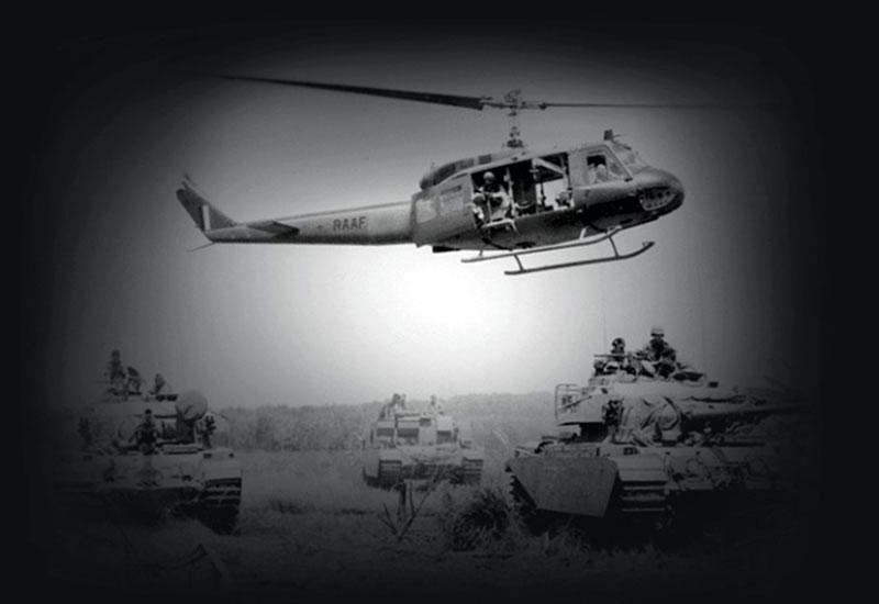 RAAF Iroquois helicopter hovers over Army Centurion Tank Patrol, 1968.
