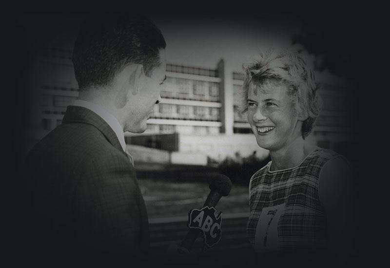 An althete being interviewed by an ABC TV reporter.