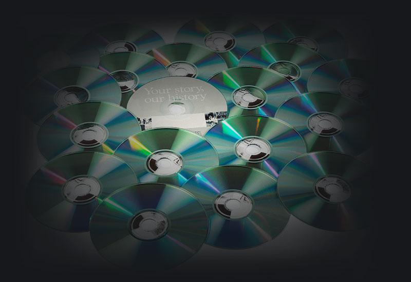 An arrangement of compact discs showing the reflective reading surface.