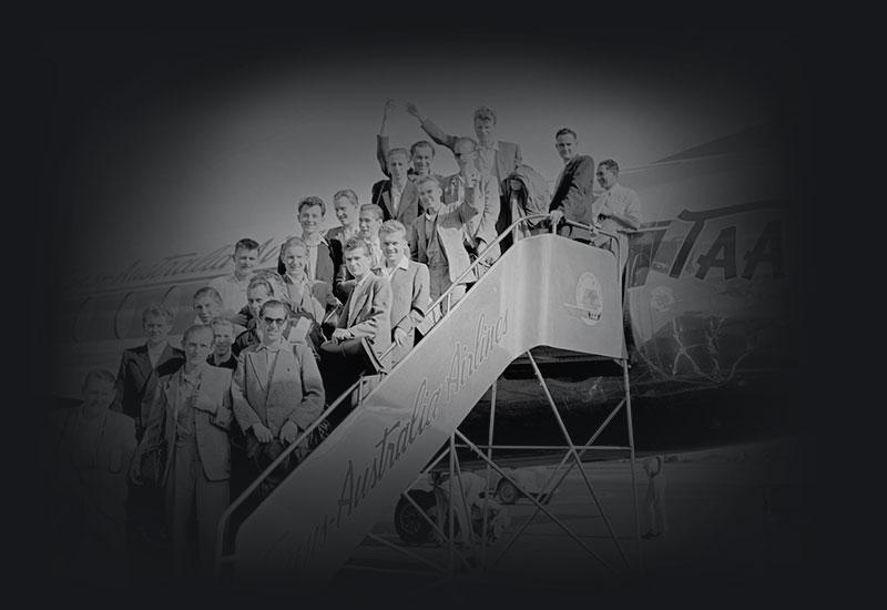 German migrants arrive aboard a VISCOUNT delivery flight. A group of twenty young German migrants arriving at Essendon airport, Melbourne, on the new Viscount turbo-jet airliner of T A A called CHARLES STURT. The migrants flew from Hamburg, Germany, under the assisted passage scheme sponsored by the Inter-governmental Commitee for European Migration