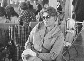 Black and white photograph of Lydia Janovska sitting in a chair.