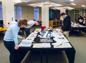 People viewing documents in the Canberra research centre