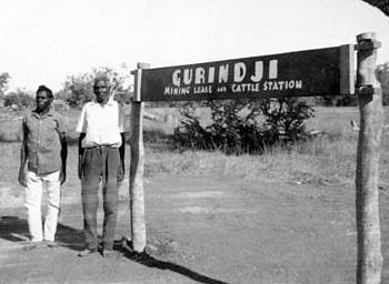 Vincent Lingiari and Mick Rangiari at the sign for Gurindji mining lease and cattle Station in 1966.