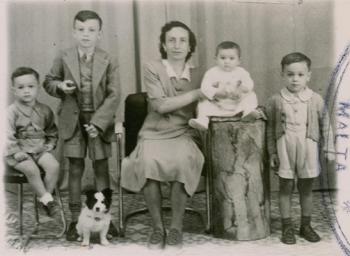 Posed photo of family and their dog.