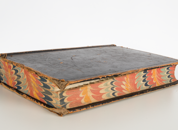 Book with marbled pages edges.