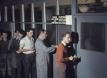 Holden workers lining up to collect their pay packets.