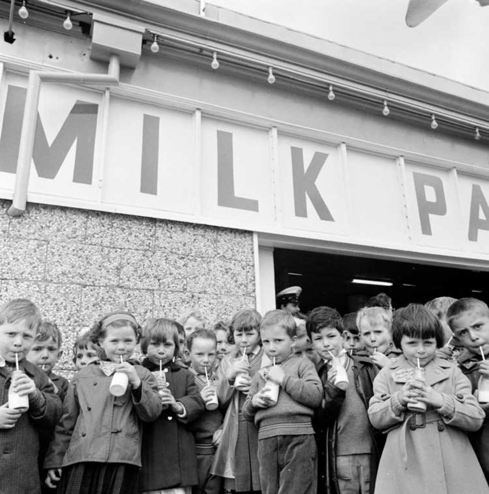 Children drinking milk at the Melbourne milk depot as part ...