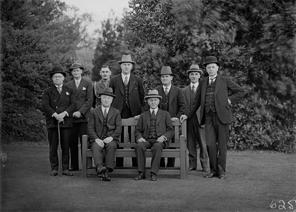 Lyons and the Governor-General, Sir Isaac Isaacs (seated) after the swearing-in of new Postmaster-General Archdale Parkhill, Minister for the Interior John Perkins, and Minister for Commerce FH Stewart. Also pictured are the Governor-General’s secretary, LS Bracegirdle, his new aide-de-camp Basil Finlay, and the secretary to the Executive Council, John Starling.
