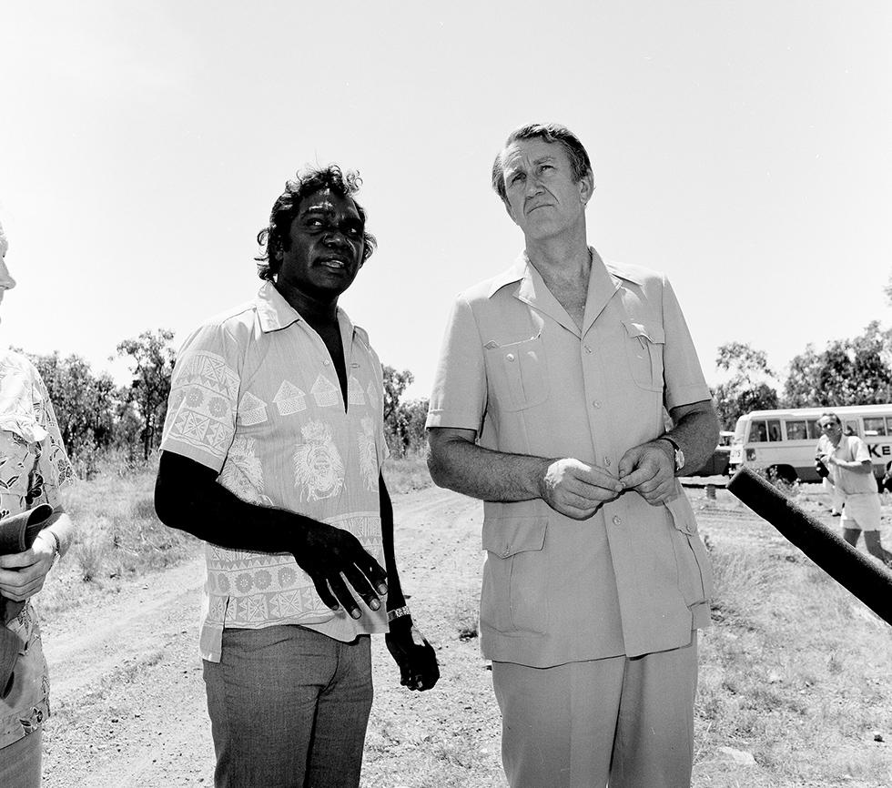 Galarrwuy Yunupingu and Malcolm Fraser standing on a dirt road.