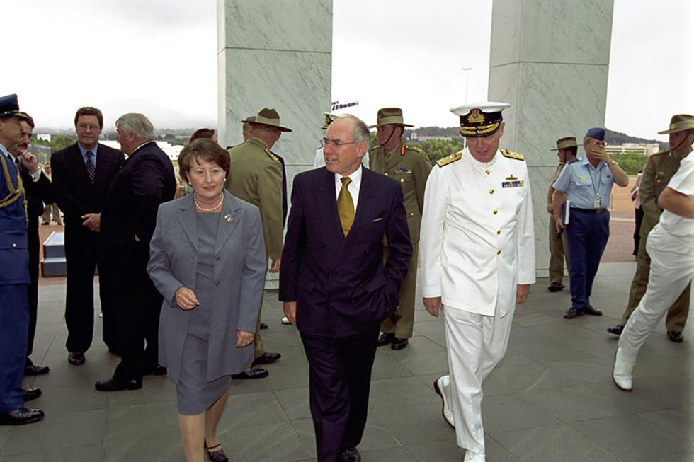 Janette and John Howard with Admiral Chris Barrie at Parliament House for the Australian of the Year Award to General Peter Cosgrove (at rear, centre), 26 January 2001.