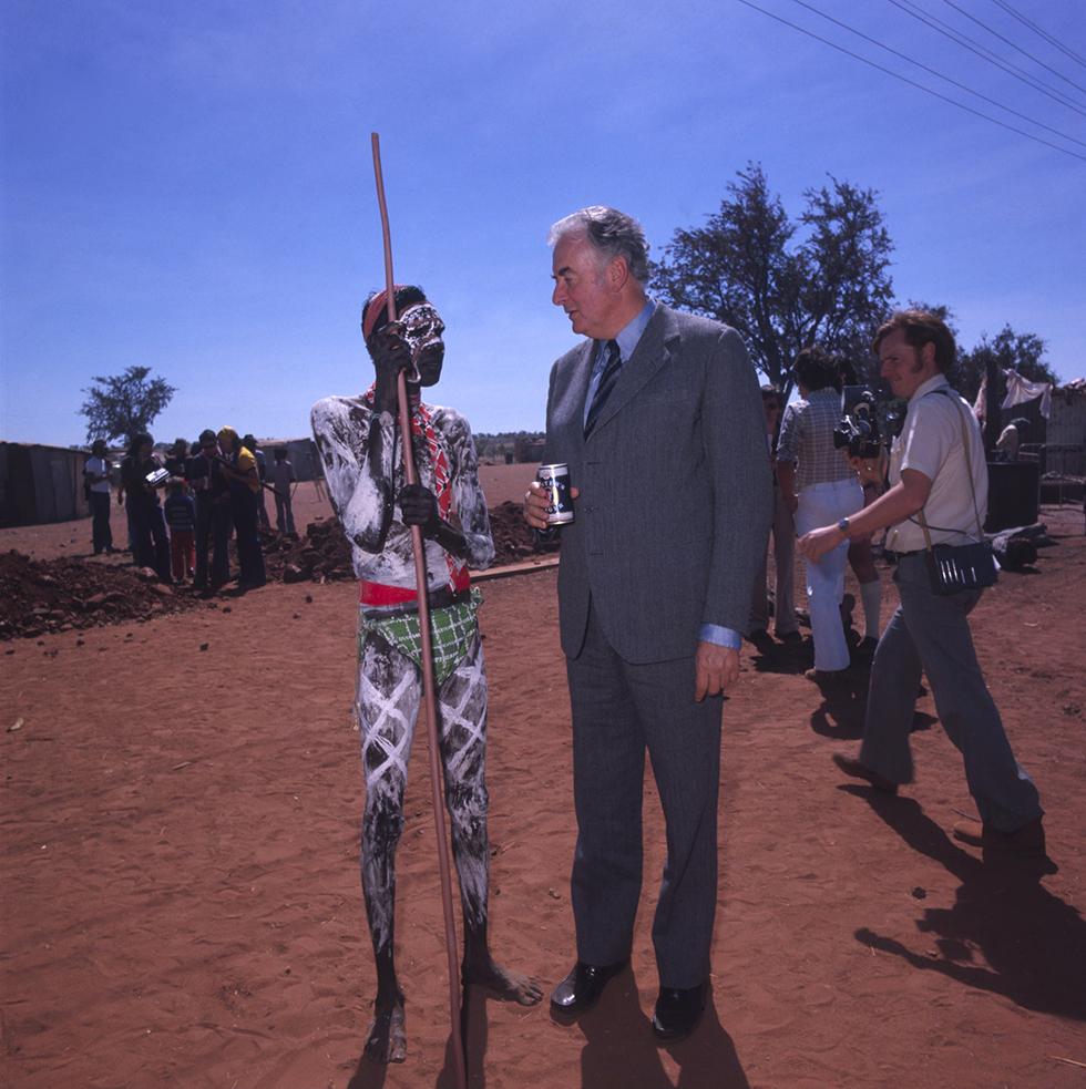 Gough Whitlam talking with Smila Underwood at Wattie Creek, 1980. Five years earlier, Whitlam took part in a symbolic ceremony to mark the return of Gurindji land to traditional owners. NAA: A8598, AK2/5/80/93