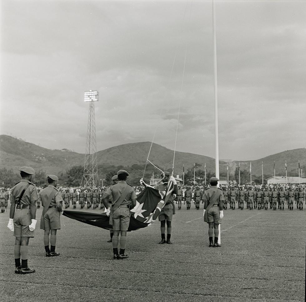 Lowering the Australian flag for the last time at Papua New Guinea Independence Day ceremonies, 15 September 1975. Gough and Margaret Whitlam were among the dignitaries who attended the celebrations. NAA: A6180, 22/9/75/20