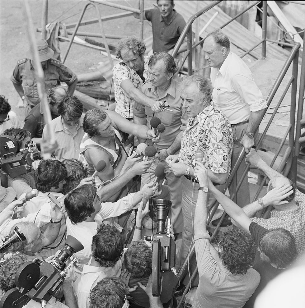 Gough Whitlam with journalists at a press conference in the wake of Cyclone Tracy, Darwin, 1974. NAA: A6180, 31/12/74/65