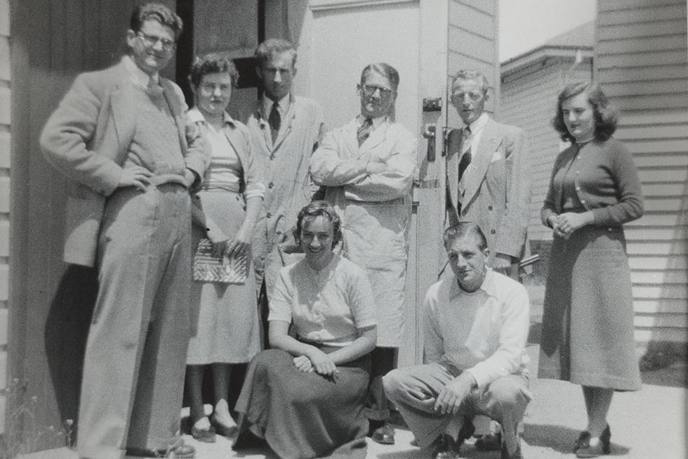 Archives Division staff, 1954. From left to right: Ian Maclean, Pat Kelly, Stewart Broadhead, Charles Gilbert, Harold Field, Jean Hamon. In front: Marjorie Vickers and John Baker.