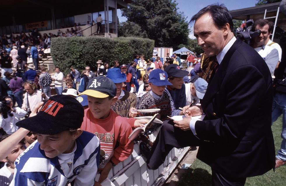 Prime Minister Paul Keating signs autographs for fans at Manuka Oval in Canberra.