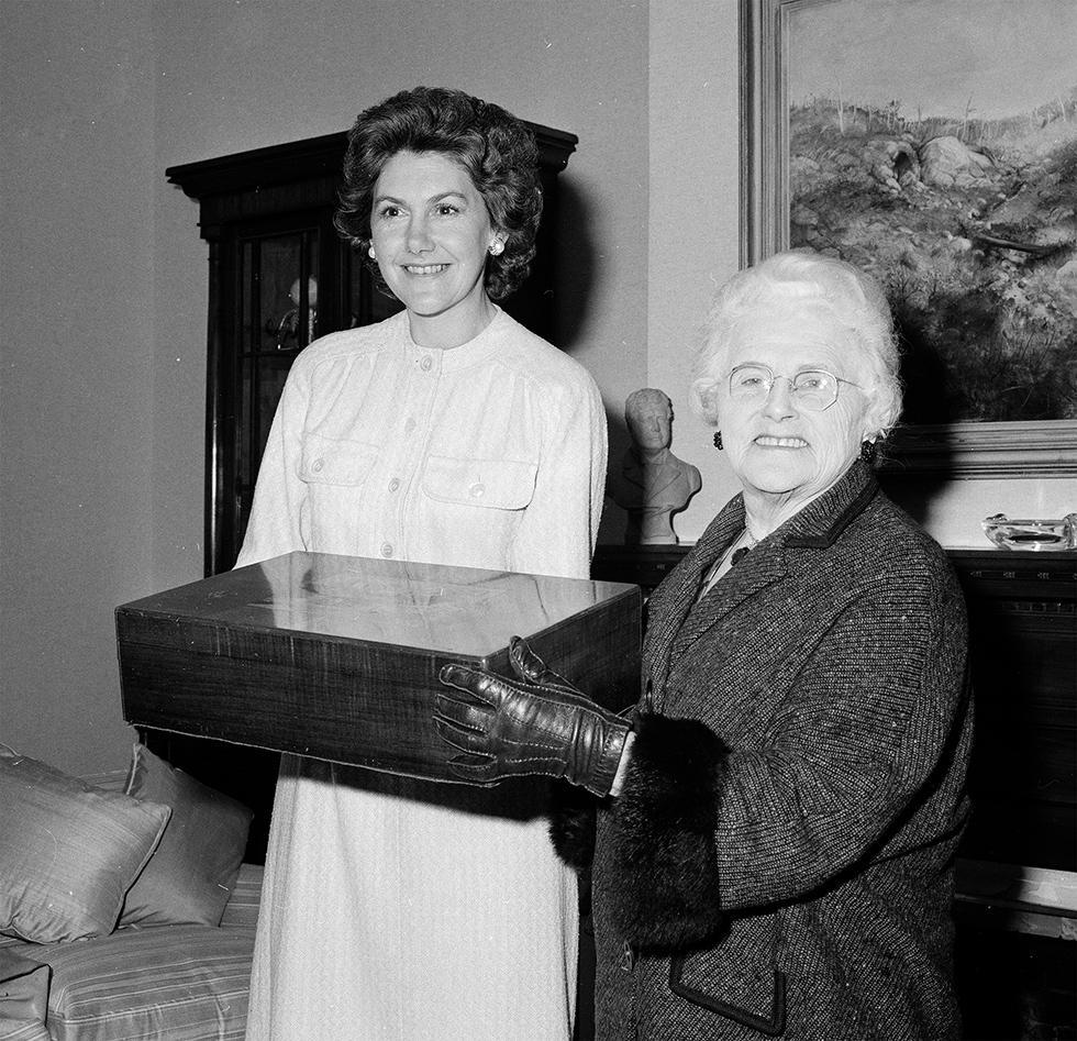 Enid Lyons presenting Tamie Fraser with an addition to the Australiana collection.