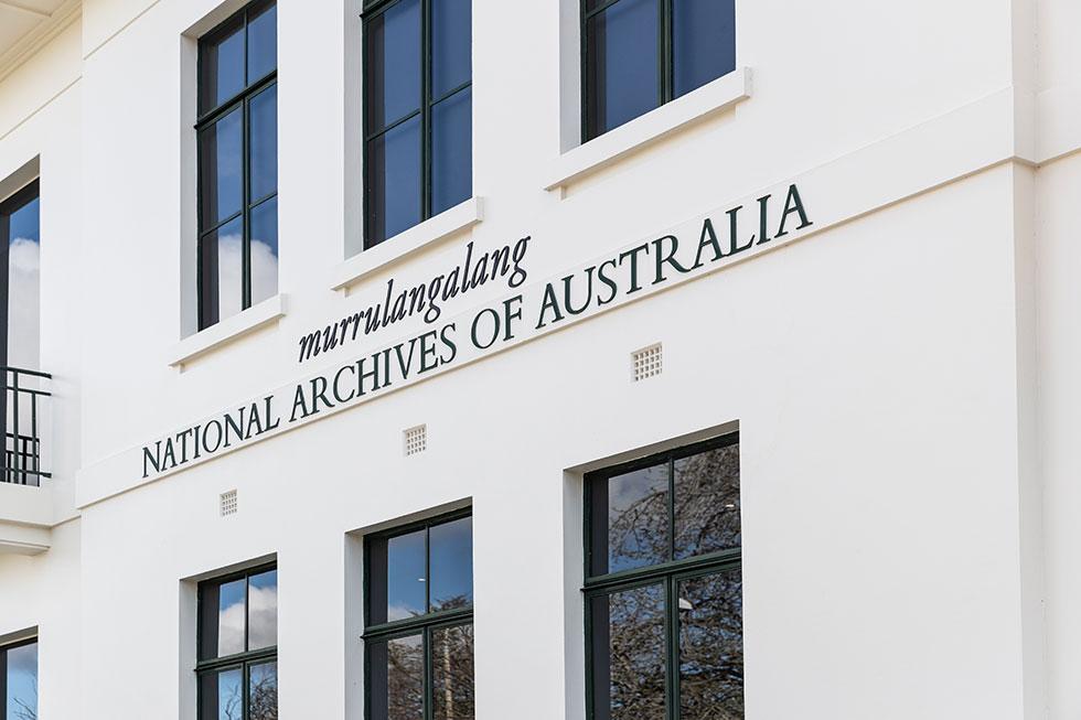 Building signage murrulangalang, National Archives of Australia, Parkes. Southern facade with iron framed windows and balcony.