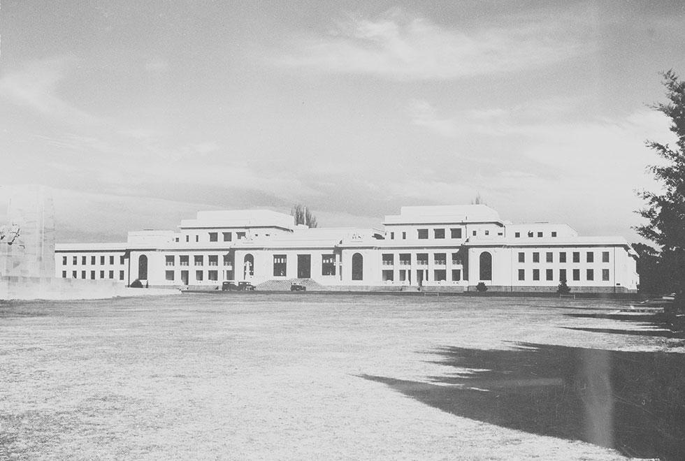 Federation style 3 storey building painted white.