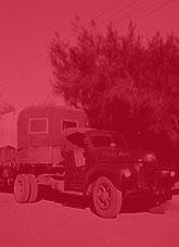 Open sided prime mover and trailer featuring sign writing 'Royal Mail, LR Tuit, Alice Springs'