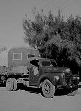 Open sided prime mover and trailer featuring sign writing 'Royal Mail, LR Tuit, Alice Springs'