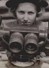 Member of the Australian Women's Army Service operating a powerful plane-finder at a northern battle station. NAA: A11663, PA189