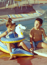 Family dining by the motel pool. 