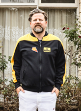 Tim Ross in front of a motel.