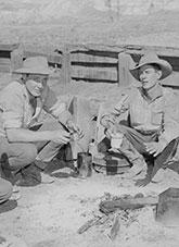 Station-hands around the campfire drinking billy tea