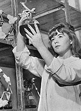 A Commonwealth Serum Laboratories scientist holding a flask of polyvalent antivenom.