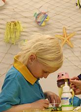 A child at a craft workshop.