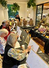 people doing still life painting.