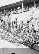 Immigration - Migrant arrivals in Australia - Italian canecutters arrive at Cairns aboard the AURELIA. Down the gangway stream the newcomers to set foot for the first time on their new chosen land.