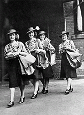 Post Women employed during the Second World War [Jean Huston, Phil Oxenham, Jean Sykes, Theo Trangmar - photo taken outside of the General Post Office Brisbane November 1942].