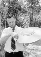 A man holds a model of a UFO.