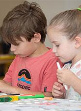 2 children with coloured markers