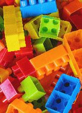 Brightly coloured plastic toy connectng blocks.