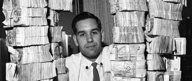  Robert Webb among the dollar notes in the vault of the Reserve Bank of Australia where he works, 1967.
