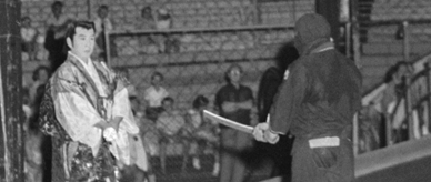 Koiche Ose performing as the samurai 'Shintaro', preparing for a swordfight with a ninja. 