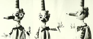 Mr Squiggle shown from three different sides. 