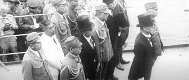 Japanese officials dressed in military uniform and suits aboard the USS Missouri.