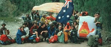Protesters holding banners and an Australian flag. 