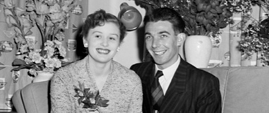 Barbara and Dennis Porritt sitting in their home. 