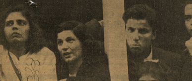 Two female and one male passenger learning on the ship's rail of the Misr.