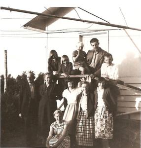 Cornelis and Cornelia Wolswinkel, with nine of their children outside their home.